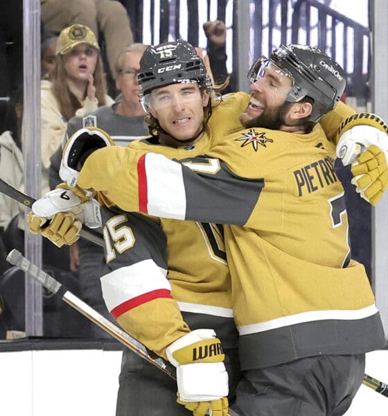 Vegas Golden Knights defenseman Noah Hanifin (15) celebrates with Vegas Golden Knights defenseman Alex Pietrangelo (7) after scoring a goal against the Montreal Canadiens during the first period of an NHL hockey game Tuesday, Dec. 31, 2024, in Las Vegas. (Steve Marcus/Las Vegas Sun via AP)