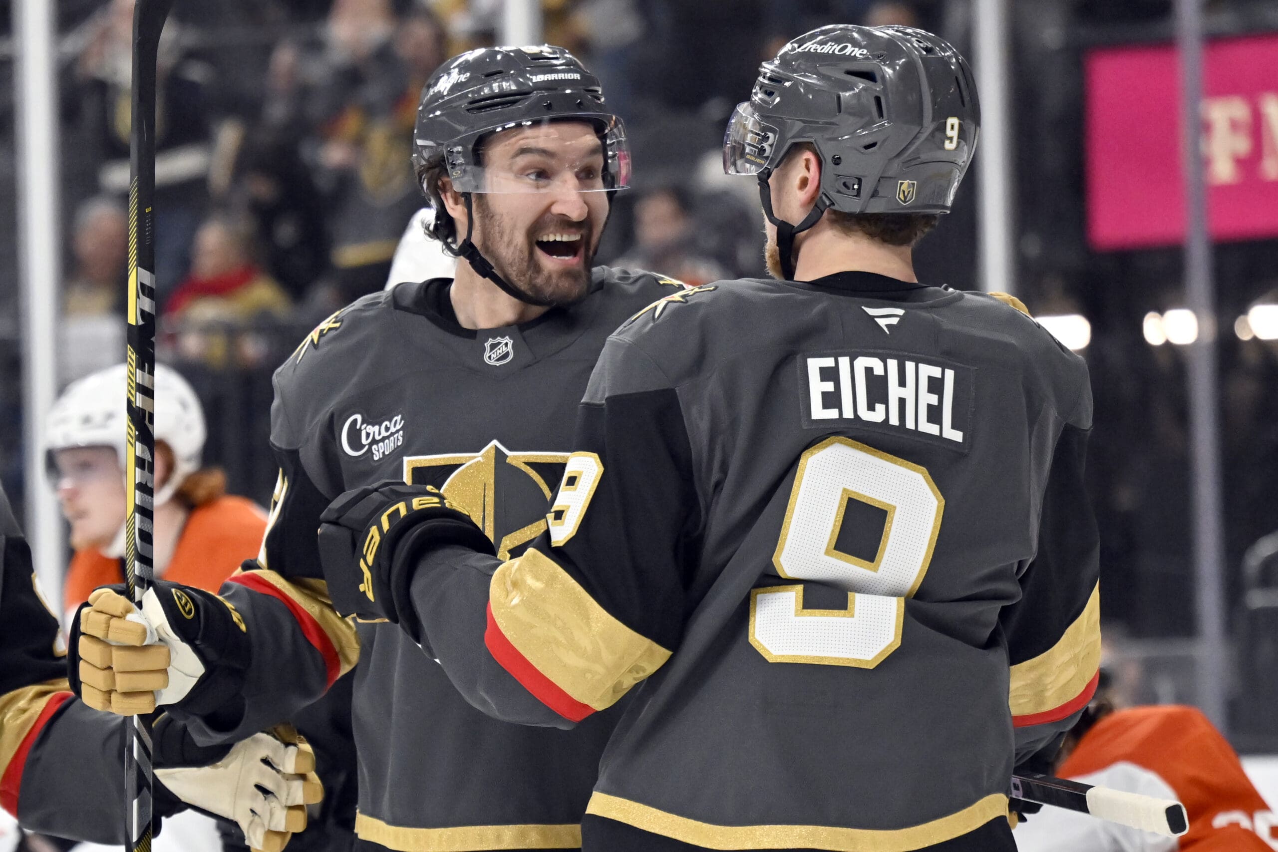 Vegas Golden Knights right wing Mark Stone, left, celebrates with center Jack Eichel (9) after scoring against the Philadelphia Flyers during the second period of an NHL hockey game Thursday, Jan. 2, 2025, in Las Vegas. (AP Photo/David Becker)