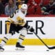 Pittsburgh Penguins' Erik Karlsson (65) moves the puck against the Carolina Hurricanes during the second period of an NHL hockey game in Raleigh, N.C., Sunday, Jan. 5, 2025. (AP Photo/Karl DeBlaker)