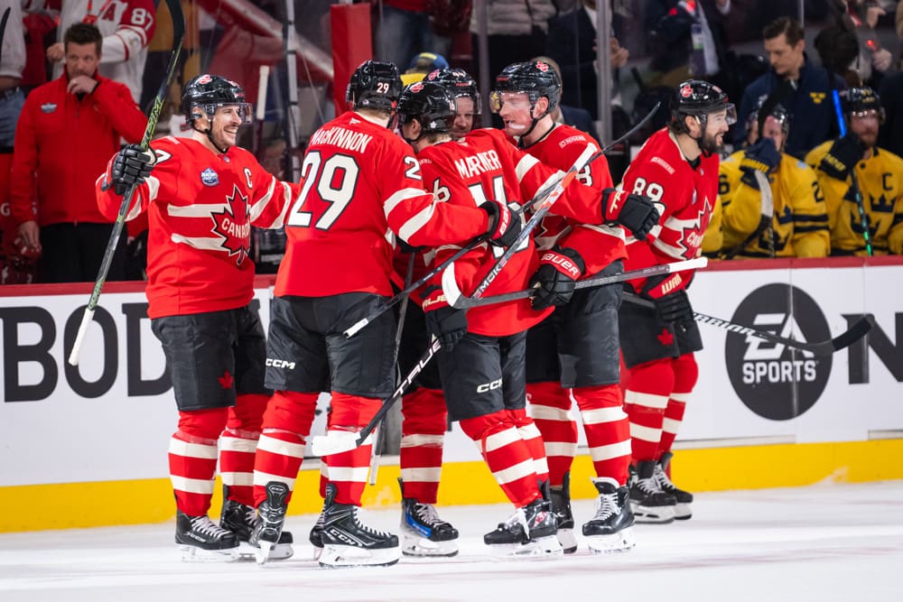 Mitch Marner (16) of Team Canada celebrates with teammates after scoring a goal during the (OT) period of the 4 Nations Face-Off game between Canada and Sweden on February 12, 2025, at Bell Centre in Montreal, Quebec
