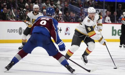 Vegas Golden Knights center Jack Eichel, right, drives down the ice with the puck as Colorado Avalanche defenseman Cale Makar drops back to cover in the second period of an NHL hockey game Wednesday, Nov. 27, 2024, in Denver. (AP Photo/David Zalubowski)