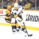 NASHVILLE, TN - MARCH 29: Nashville Predators forward Jonathan Marchessault (81) defends against Vegas Golden Knights defenseman Zach Whitecloud (2) during the NHL game between the Nashville Predators and Vegas Golden Knights, held on March 29, 2025, at Bridgestone Arena in Nashville, Tennessee. (Photo by Danny Murphy/Icon Sportswire)