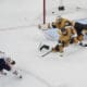 Edmonton Oilers center Leon Draisaitl (29) scores against Vegas Golden Knights goaltender Adin Hill (33) during overtime of Game 2 of a second-round NHL hockey playoff series Thursday, May 8, 2025, in Las Vegas. (AP Photo/John Locher)