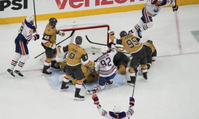 Edmonton Oilers right wing Kasperi Kapanen, upper right, celebrates after scoring against the Vegas Golden Knights during overtime of Game 5 of a second-round NHL hockey playoff series Wednesday, May 14, 2025, in Las Vegas. (AP Photo/John Locher)