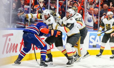 EDMONTON, AB - MAY 12: Las Vegas Golden Knights Center Brett Howden (21) and Las Vegas Golden Knights Goalie Aden Hill (33) attack Edmonton Oilers Right Wing Evander Kane (91) in the first period of the Stanley Cup Playoffs Second Round Edmonton Oilers game versus the Las Vegas Golden Knights on May 12, 2025 at Rogers Place in Edmonton, AB. (Photo by Curtis Comeau/Icon Sportswear)