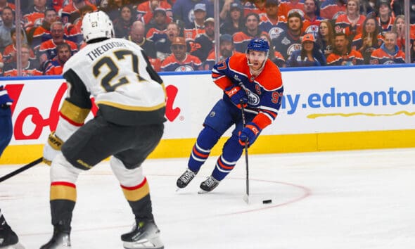 EDMONTON, AB - MAY 12: Las Vegas Golden Knights Defenceman Shea Theodore (27) stops Edmonton Oilers Center Connor McDavid (97) in the first period of the Stanley Cup Playoffs Second Round Edmonton Oilers game versus the Las Vegas Golden Knights on May 12, 2025 at Rogers Place in Edmonton, AB. (Photo by Curtis Comeau/Icon Sportswear)