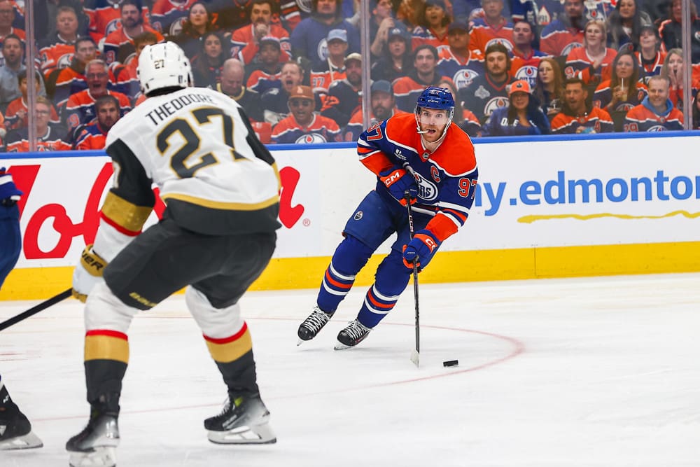 EDMONTON, AB - MAY 12: Las Vegas Golden Knights Defenceman Shea Theodore (27) stops Edmonton Oilers Center Connor McDavid (97) in the first period of the Stanley Cup Playoffs Second Round Edmonton Oilers game versus the Las Vegas Golden Knights on May 12, 2025 at Rogers Place in Edmonton, AB. (Photo by Curtis Comeau/Icon Sportswear)