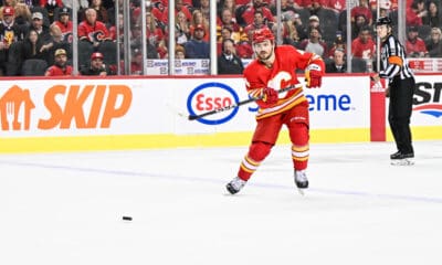 CALGARY, AB - OCTOBER 18: Calgary Flames Defenceman Rasmus Andersson (4) passes the puck during the second period of an NHL game between the Calgary Flames and the Vegas Golden Knights on October 18, 2022, at the Scotiabank Saddledome in Calgary, AB. (Photo by Brett Holmes/Icon Sportswire)