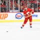 CALGARY, AB - OCTOBER 18: Calgary Flames Defenceman Rasmus Andersson (4) passes the puck during the second period of an NHL game between the Calgary Flames and the Vegas Golden Knights on October 18, 2022, at the Scotiabank Saddledome in Calgary, AB. (Photo by Brett Holmes/Icon Sportswire)