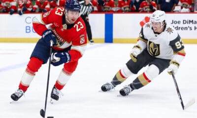 SUNRISE, FL - OCTOBER 25: Florida Panthers center Carter Verhaeghe (23) skates with the puck as Vegas Golden Knights right wing Mitch Marner (93) looks on in the second period during the game between the Golden Knights and the Florida Panthers on Saturday, October 25, 2025 at Amerant Bank Arena in Sunrise, FL.(Photo by Chris Arjoon/Icon Sportswire)