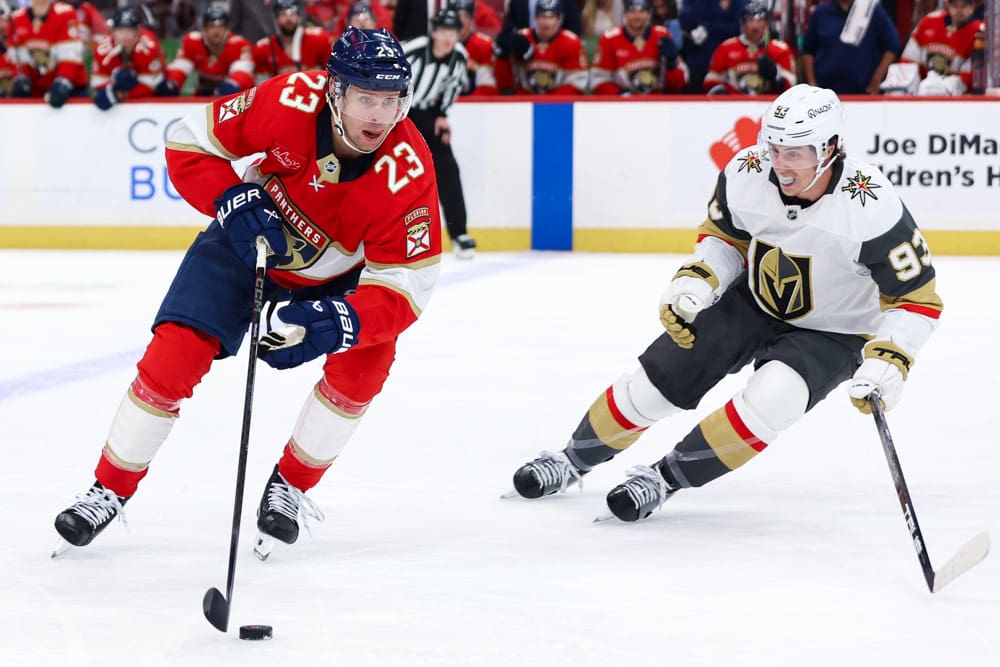 SUNRISE, FL - OCTOBER 25: Florida Panthers center Carter Verhaeghe (23) skates with the puck as Vegas Golden Knights right wing Mitch Marner (93) looks on in the second period during the game between the Golden Knights and the Florida Panthers on Saturday, October 25, 2025 at Amerant Bank Arena in Sunrise, FL.(Photo by Chris Arjoon/Icon Sportswire)