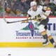 ST. PAUL, MN - DECEMBER 15: Vegas Golden Knights right wing Alexander Holtz (26) passes the puck during the NHL game between the Vegas Golden Knights and Minnesota Wild on December 15th, 2024, at the Xcel Energy Center in St. Paul, MN. (Photo by Bailey Hillesheim/Icon Sportswire)