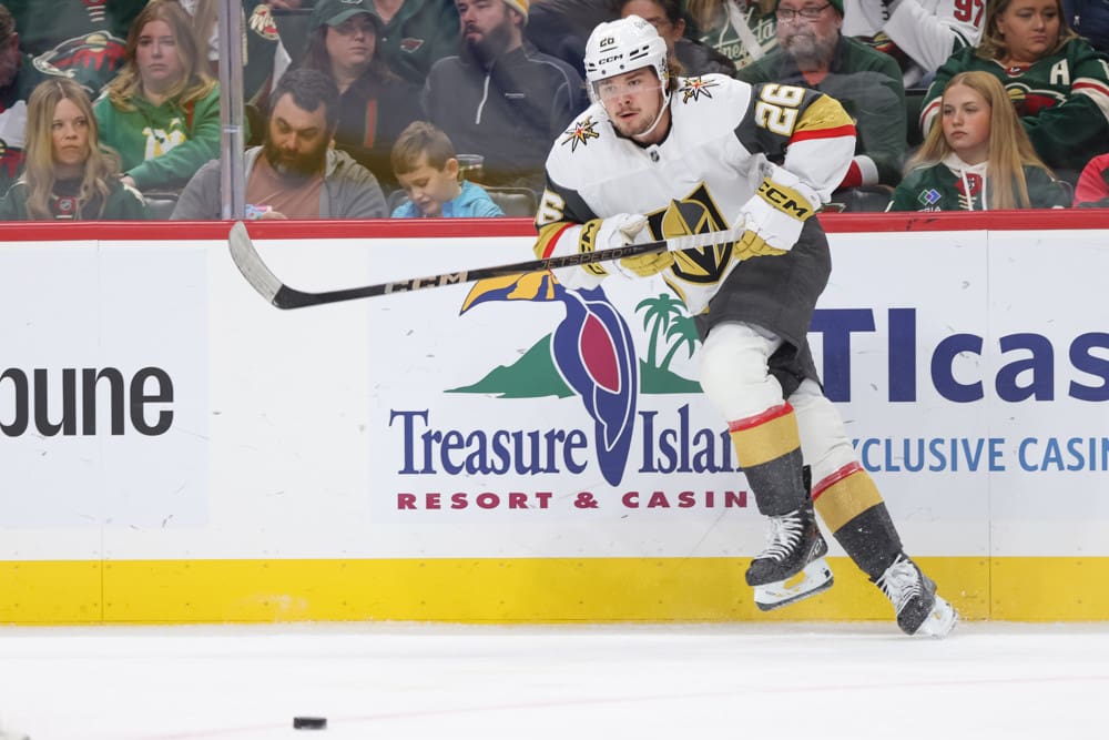 ST. PAUL, MN - DECEMBER 15: Vegas Golden Knights right wing Alexander Holtz (26) passes the puck during the NHL game between the Vegas Golden Knights and Minnesota Wild on December 15th, 2024, at the Xcel Energy Center in St. Paul, MN. (Photo by Bailey Hillesheim/Icon Sportswire)