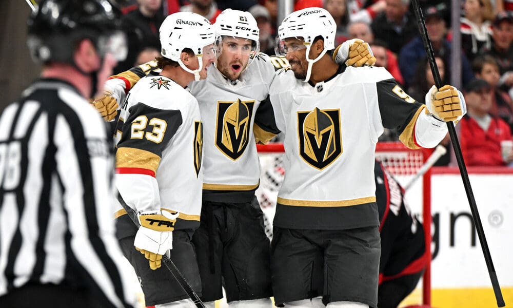 RALEIGH, NC - OCTOBER 28: Vegas Golden Knights center Brett Howden (21) celebrates with Vegas Golden Knights left wing Cole Reinhardt (23) and Vegas Golden Knights right wing Keegan Kolesar (55) after scoring a goal during the NHL game between the Vegas Golden Knights and the Carolina Hurricanes on October 28, 2025 at Lenovo Center in Raleigh, North Carolina. (Photo by Katherine Gawlik/Icon Sportswire)